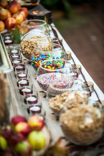 an assortment of candies and desserts on a buffet table at a birthday party