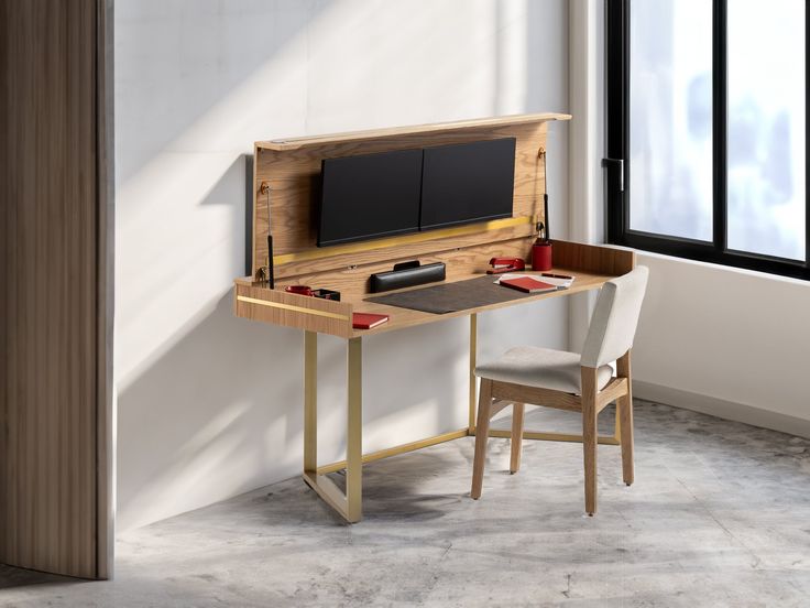 a wooden desk with a computer monitor on it