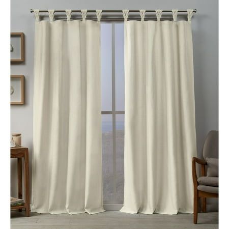 an open window with white curtains in it