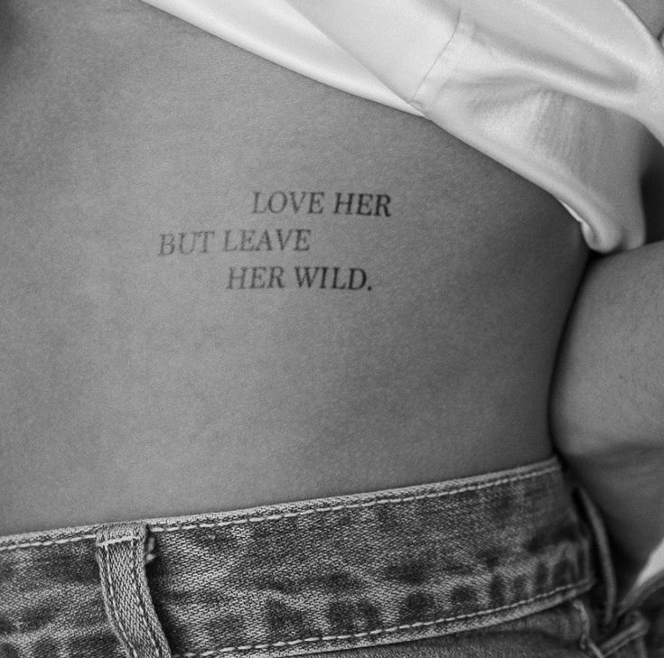 a woman's stomach with the words love her but leave her wild written on it