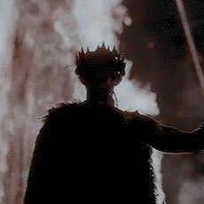 the silhouette of a man with a crown on his head