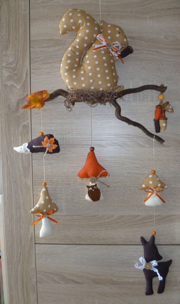 a group of ornaments hanging from a wooden wall