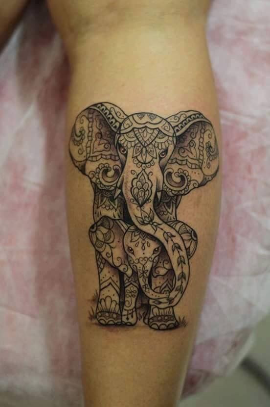 an elephant tattoo on the leg