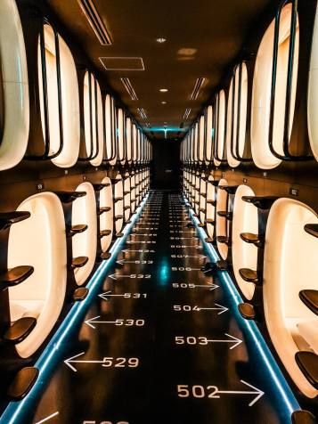 the inside of an airplane with rows of seats and arrows pointing in different directions on it