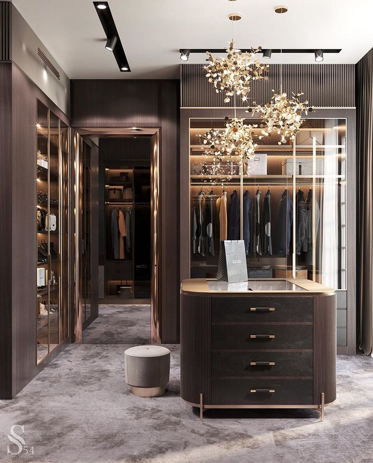 a walk - in closet with a chandelier hanging from it's ceiling