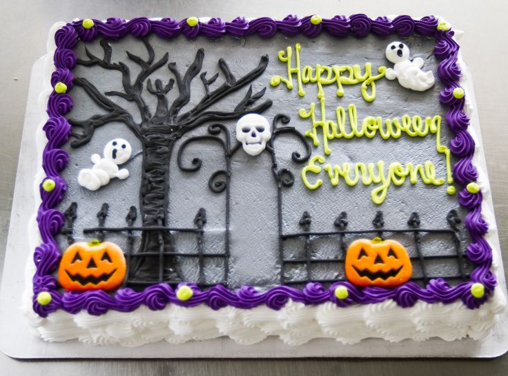 a birthday cake decorated with halloween decorations