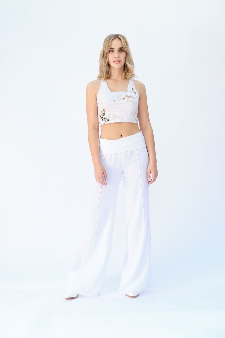 Our versatile Dakota Pant will be your new favorite go-to summer style! Featuring our ultra soft fold-over waistband that can be folded for a low rise, high waist or even over a baby bump! The vertical leg seam detail makes this pair of pants work as a dressed up dinner look. These are made with a raw hem and long enou Chic Fitted Wide Leg Pants With Wide Waistband, Spring High Waist Wide Leg Pants With Wide Waistband, Fitted Wide Leg Bottoms With Waistband, Fitted Cotton Dress Pants For Summer, Summer High-waisted Pants With Wide Waistband, Chic Pants With Wide Waistband For Summer, Chic Summer Pants With Wide Waistband, Chic Straight Leg Yoga Pants, Versatile Summer Yoga Pants With Elastic Waistband