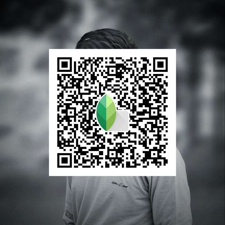 a person with a qr code on their face to see what they are doing