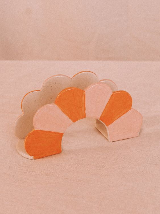 an orange and white object sitting on top of a table