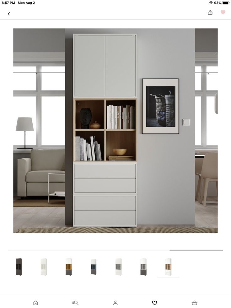 an image of a book shelf with books on it in the middle of a room