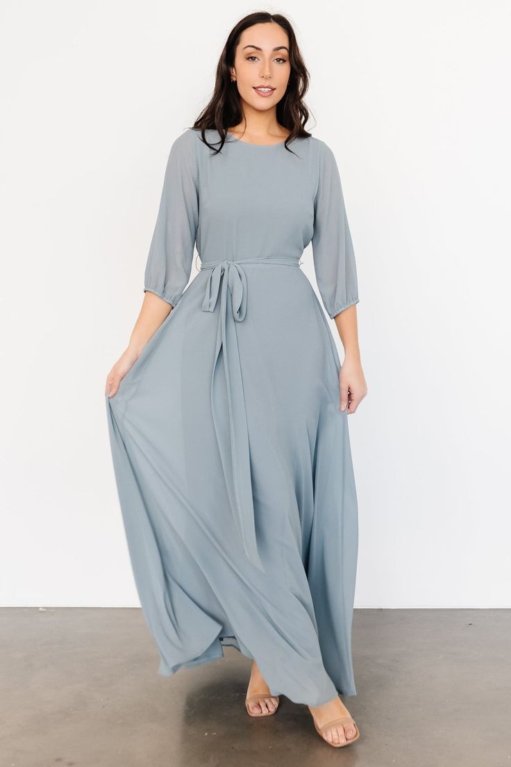 A beautiful and feminine style for any occasion! Rebecca is a beautiful addition to any wardrobe! Dusty Blue Maxi Dresses, Dusty Blue Maxi Dress, Blue Long Sleeve Wedding Dress, Winter Bridesmaid Dresses Blue, Modest Blue Dress, Long Modest Dresses, Sea Blue Dress, Modest Bridesmaid Dresses With Sleeves, Modest Bridesmaid Dress