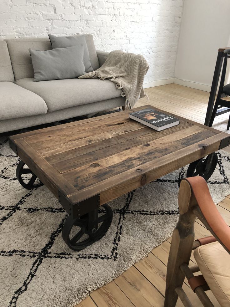 a living room with a couch, table and chair