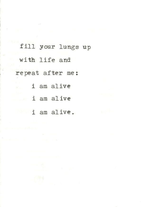 an old typewriter with the words fill your lungs up with life and repeat after me i am alive i am alive