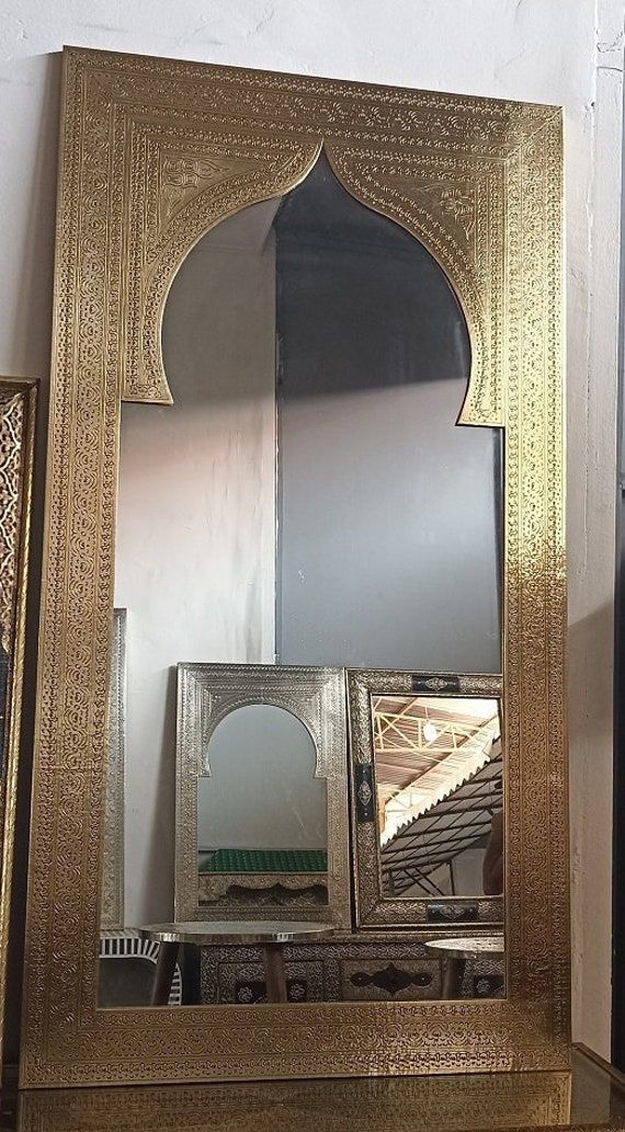 a mirror that is sitting on top of a table