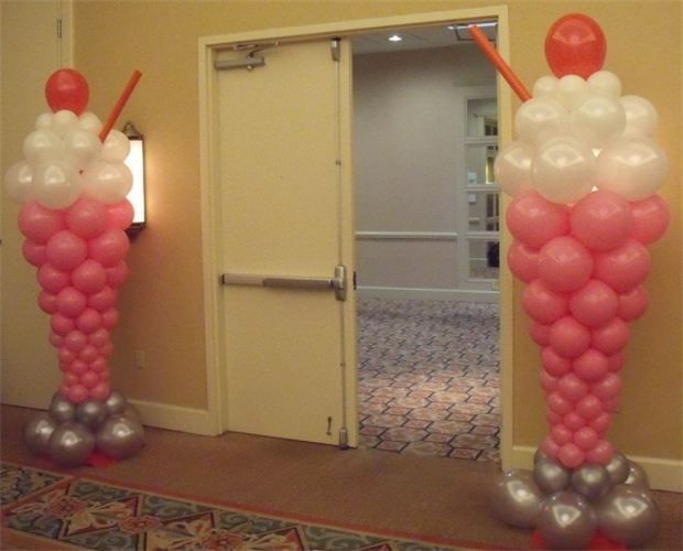 two tall balloons in the shape of ice cream cones