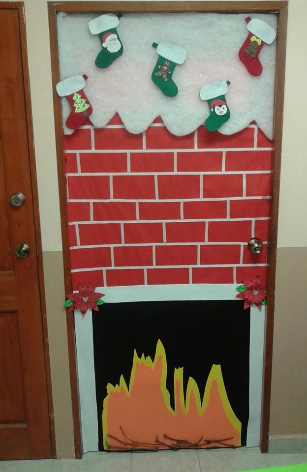 a fireplace decorated with stockings and stockings hanging from the mantle, on top of a red brick wall