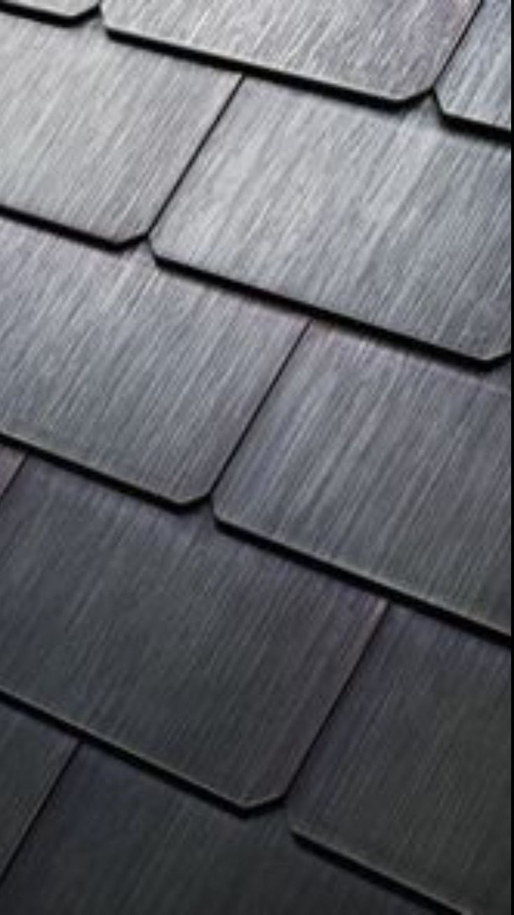 a close up view of a roof that has been cleaned and is black in color