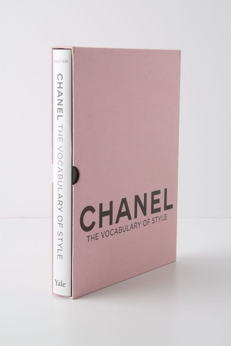 a pink book with the words chanel written in black on it's cover