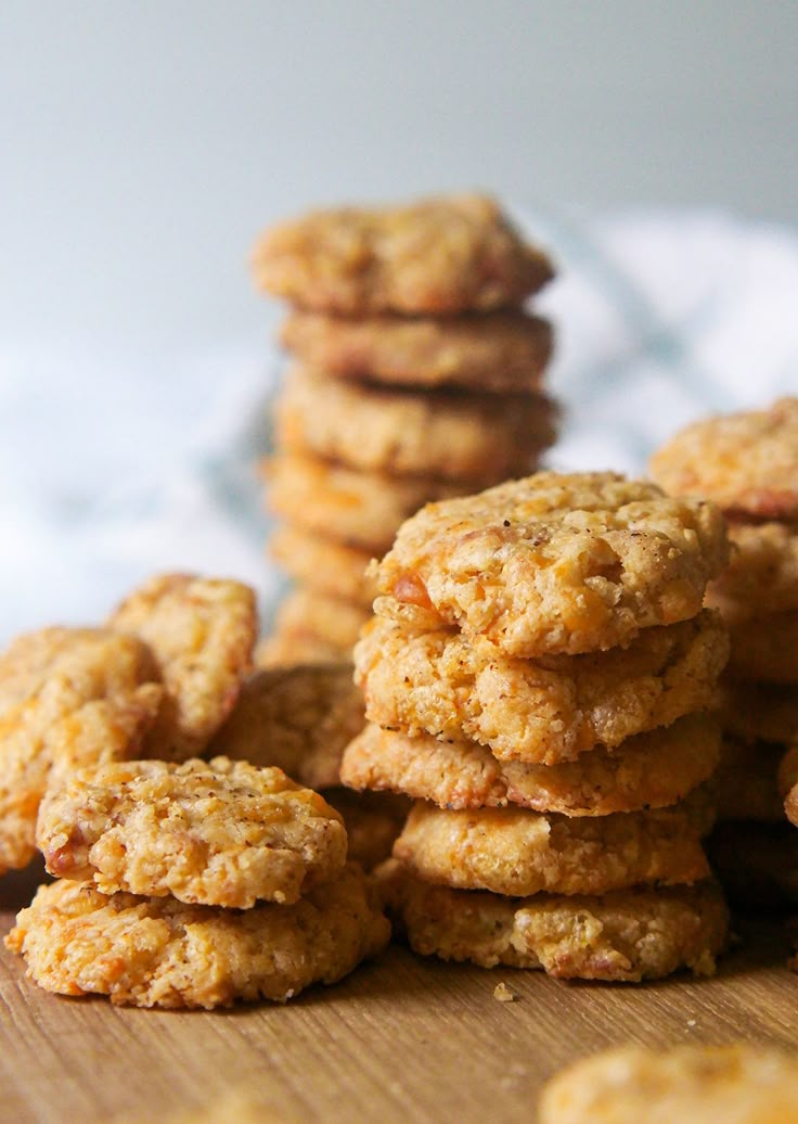 a pile of cookies sitting on top of a wooden table