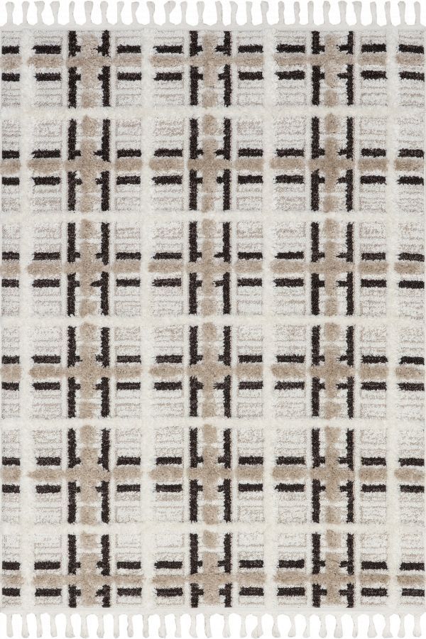 a white and brown rug with fringes on the bottom, in an area that looks like it has been made out of fabric