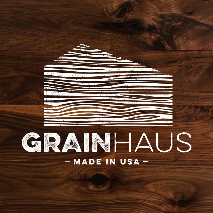 the logo for grainhauss made in usa on top of wooden planks with white lettering