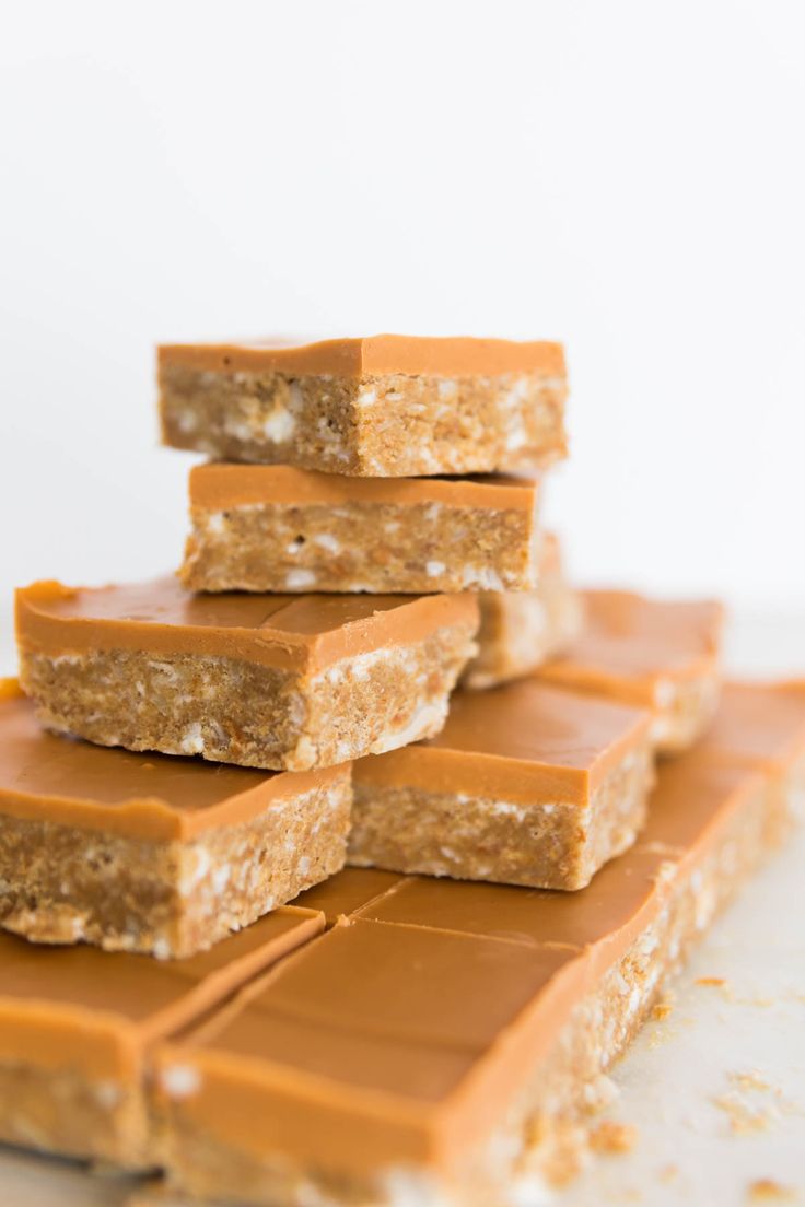 several pieces of peanut butter bars stacked on top of each other