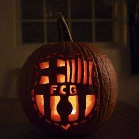 a carved pumpkin sitting on top of a table with the word f is spelled in it