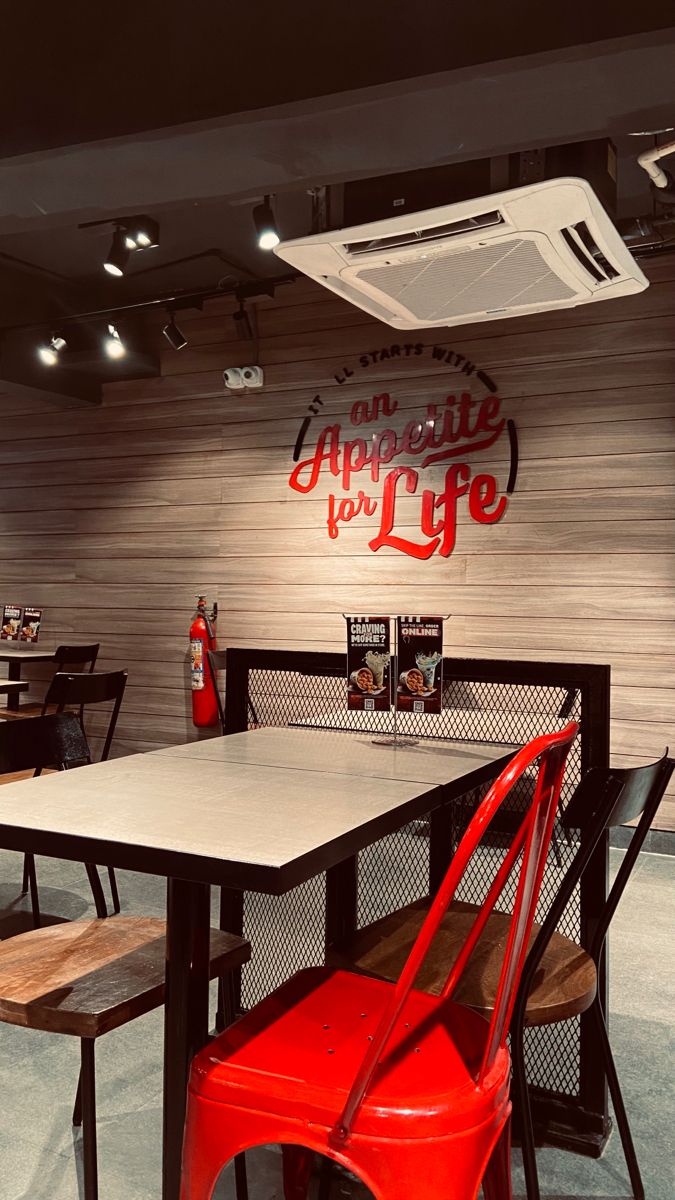 an empty restaurant with tables and chairs in front of the sign that says appetizing for life