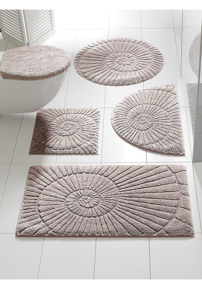 bathroom rugs in various shapes and sizes on the floor