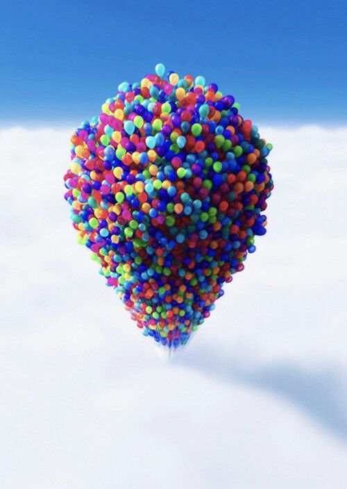 the balloon is floating in the sky above the clouds