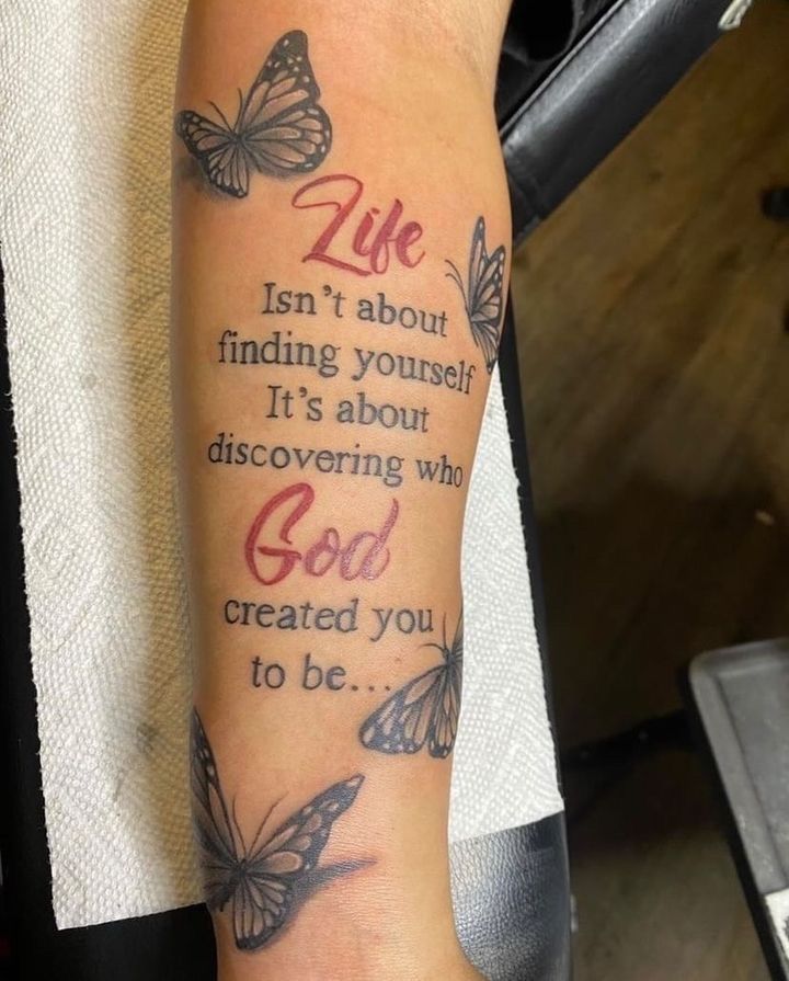 a person with a tattoo on their arm that says, life isn't about finding yourself it's about discovering who god created you to be