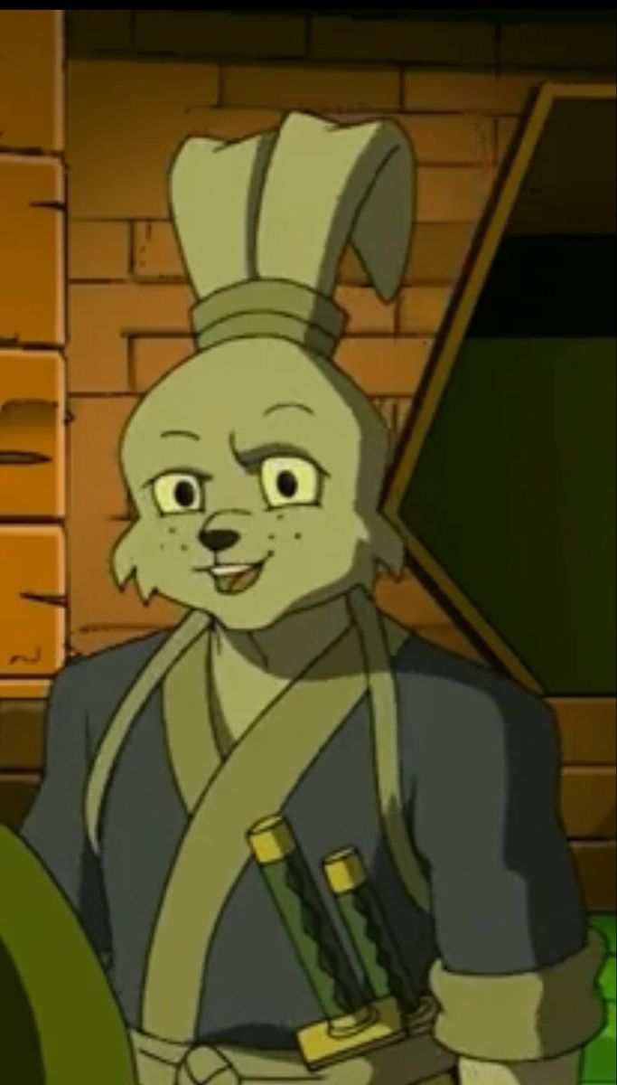 an animated rabbit dressed in costume standing next to a brick wall and looking at the camera