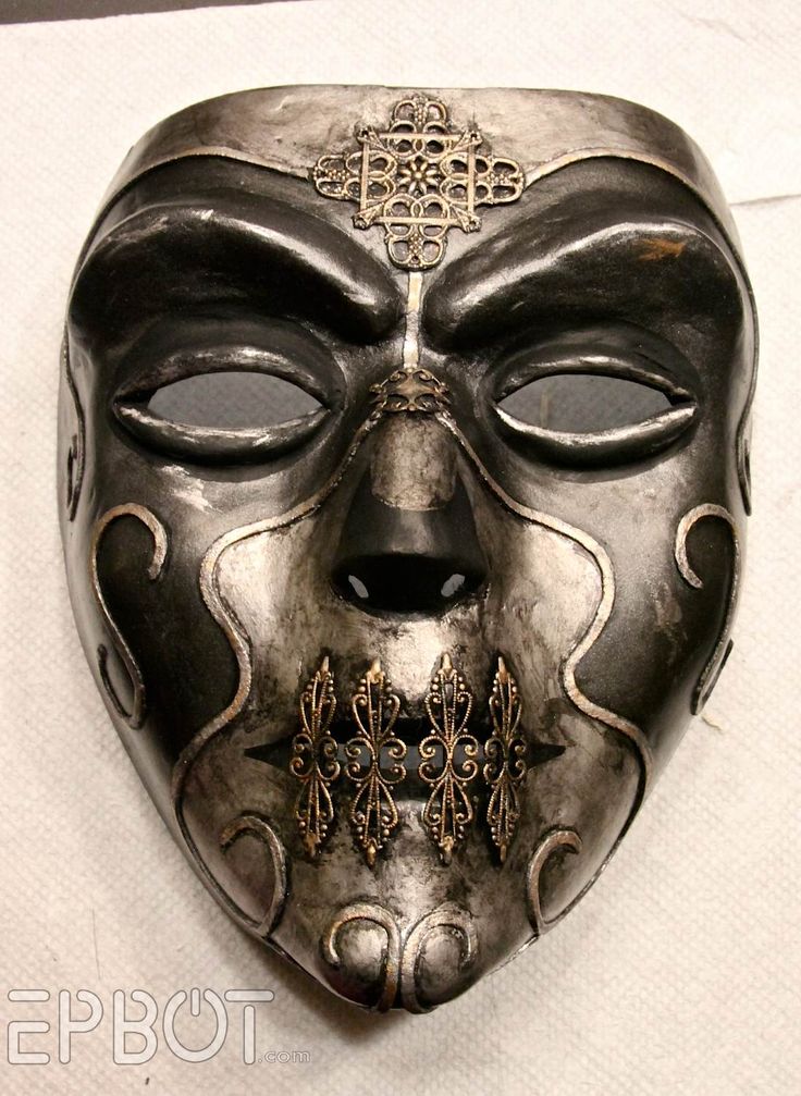 a metal mask with ornate designs on it