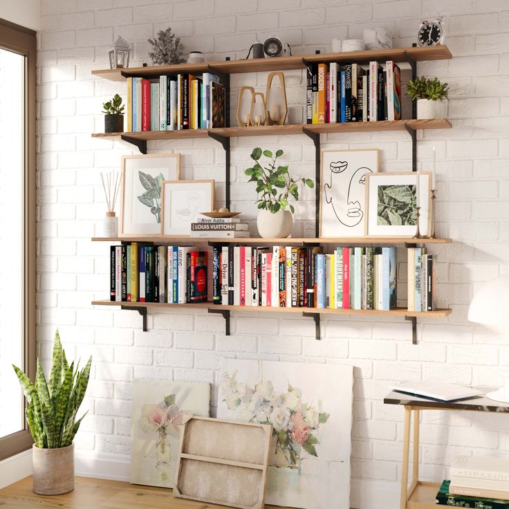 a bookshelf filled with lots of books on top of a wooden table next to a window