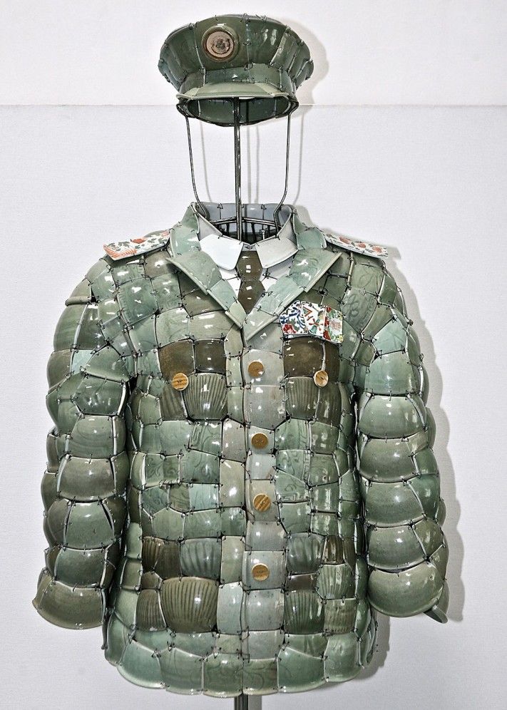 an army uniform made out of plastic cups