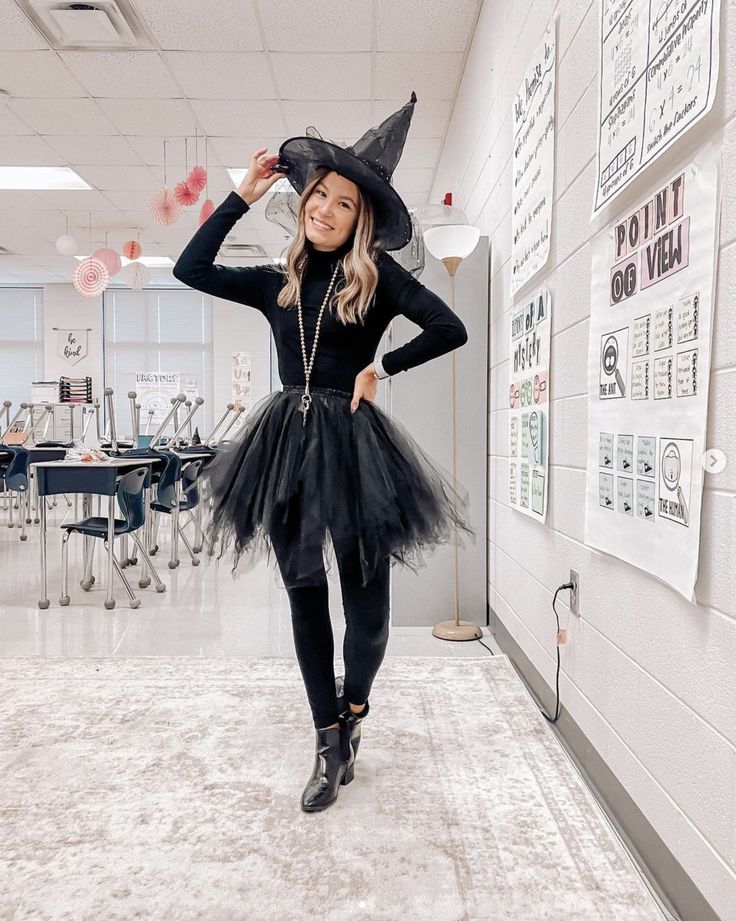 a woman in a witch costume poses for the camera