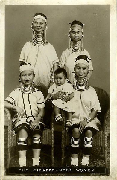 an old black and white photo of four women with their heads in the shape of people