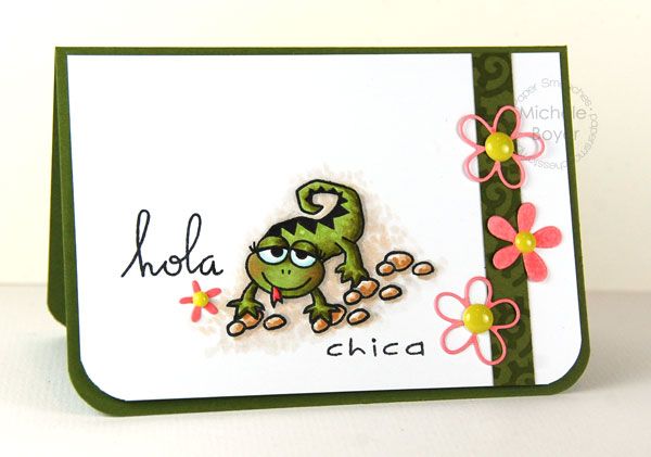 a close up of a greeting card with a frog on it's back and flowers in the background