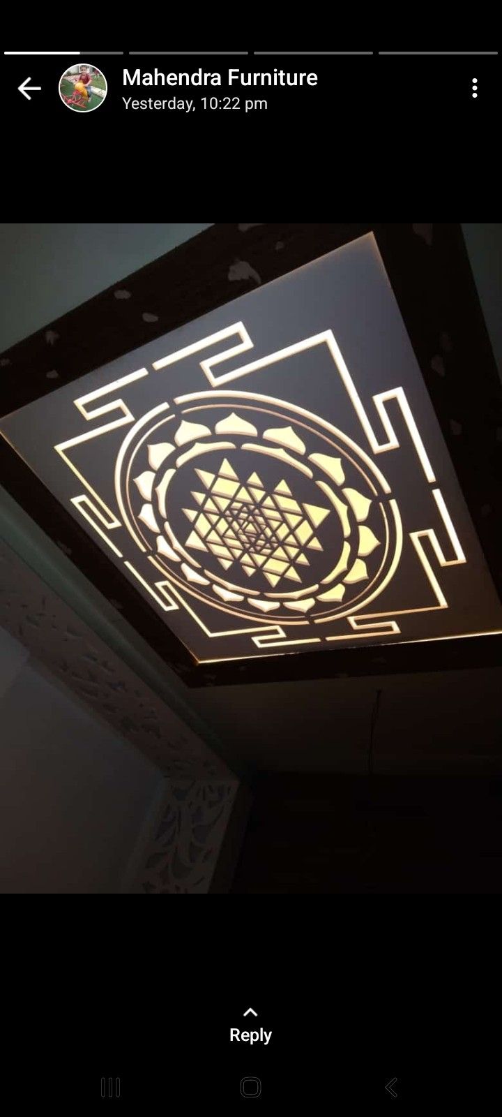 the ceiling light is lit up and has an intricate design on it