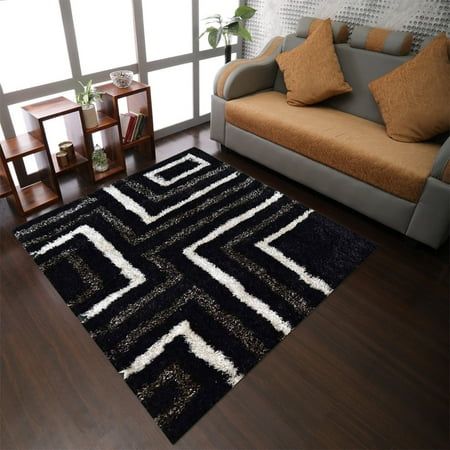 a black and white rug in a living room