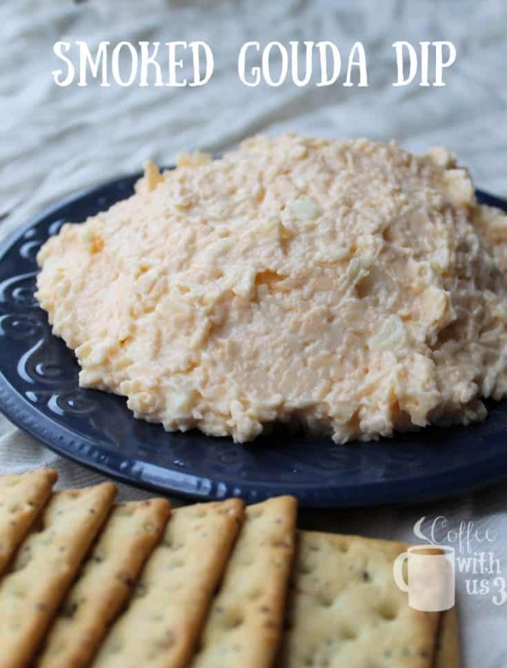 a plate with crackers and some food on it