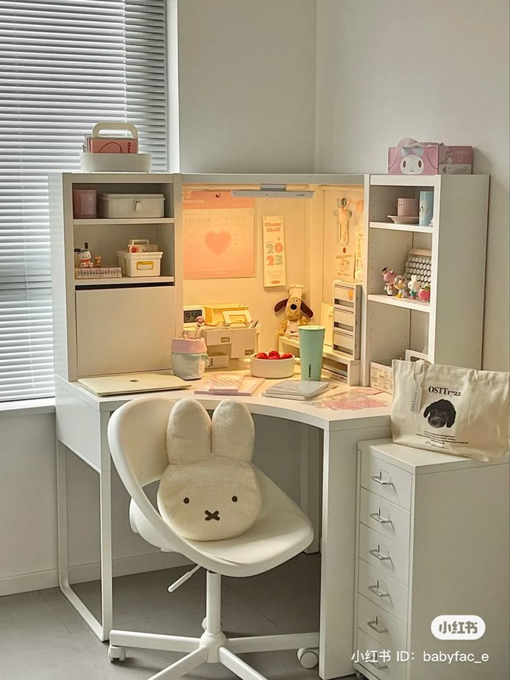 a white desk with a stuffed animal chair in front of it and shelves above the desk