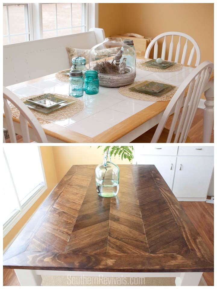 the table is made out of wood and has two vases on it