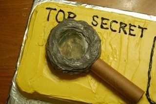 a top secret cake with a hammer on it