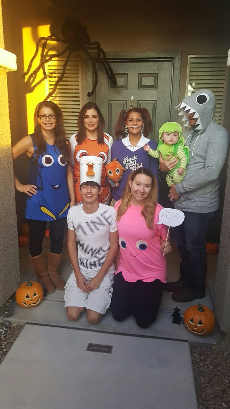 a group of people in costumes posing for a photo