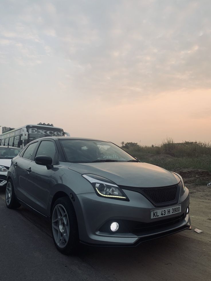 two cars are parked on the side of the road