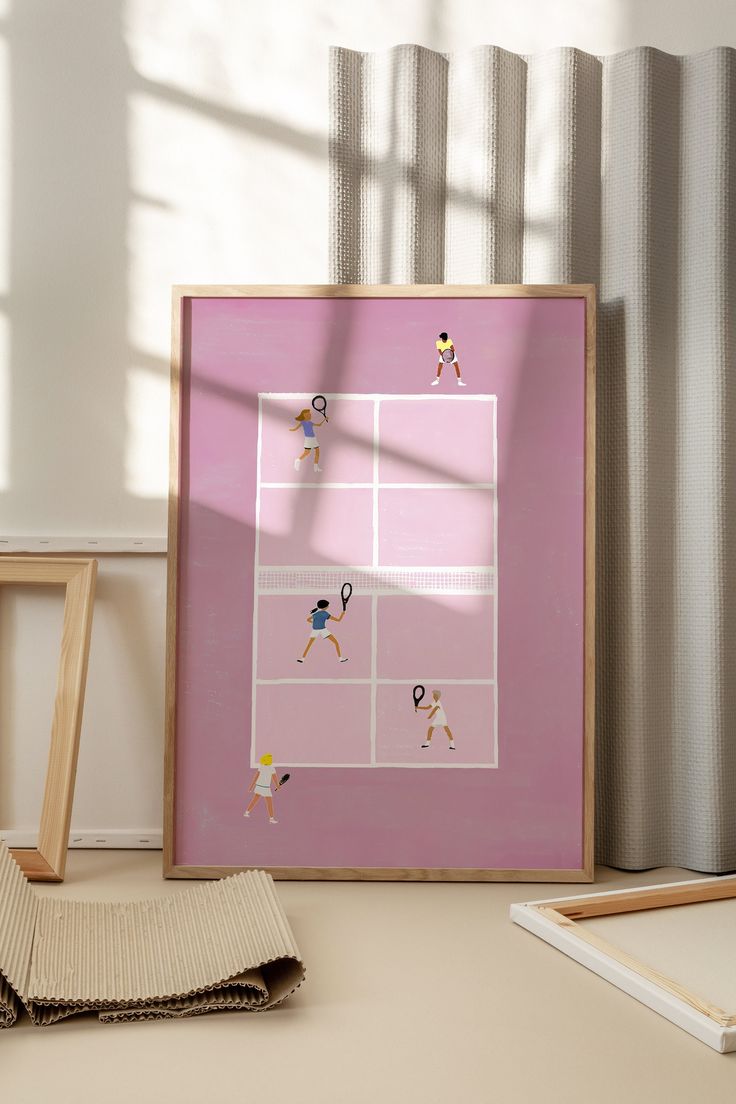 there is a pink framed photo with people playing tennis on the court in front of curtains