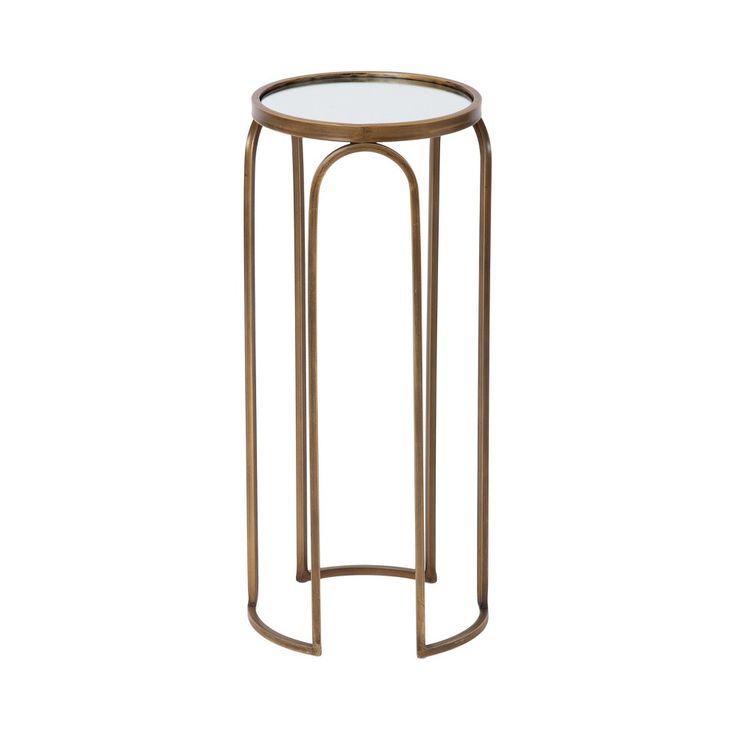 the side table has a glass top and gold metal frame, with a circular base