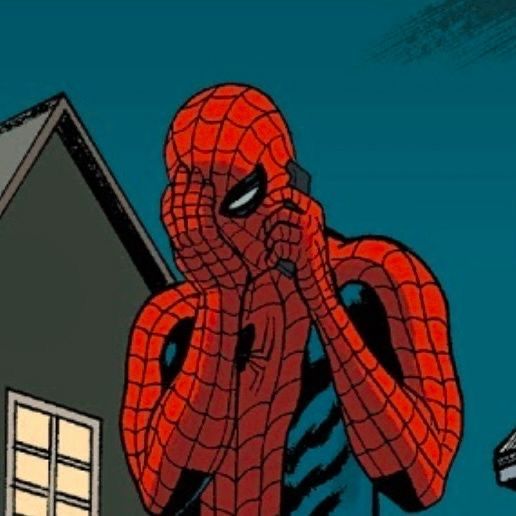 a spider - man standing in front of a house with his hands to his face