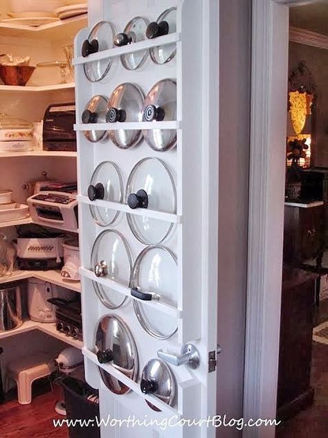 an open refrigerator door with plates and bowls on it